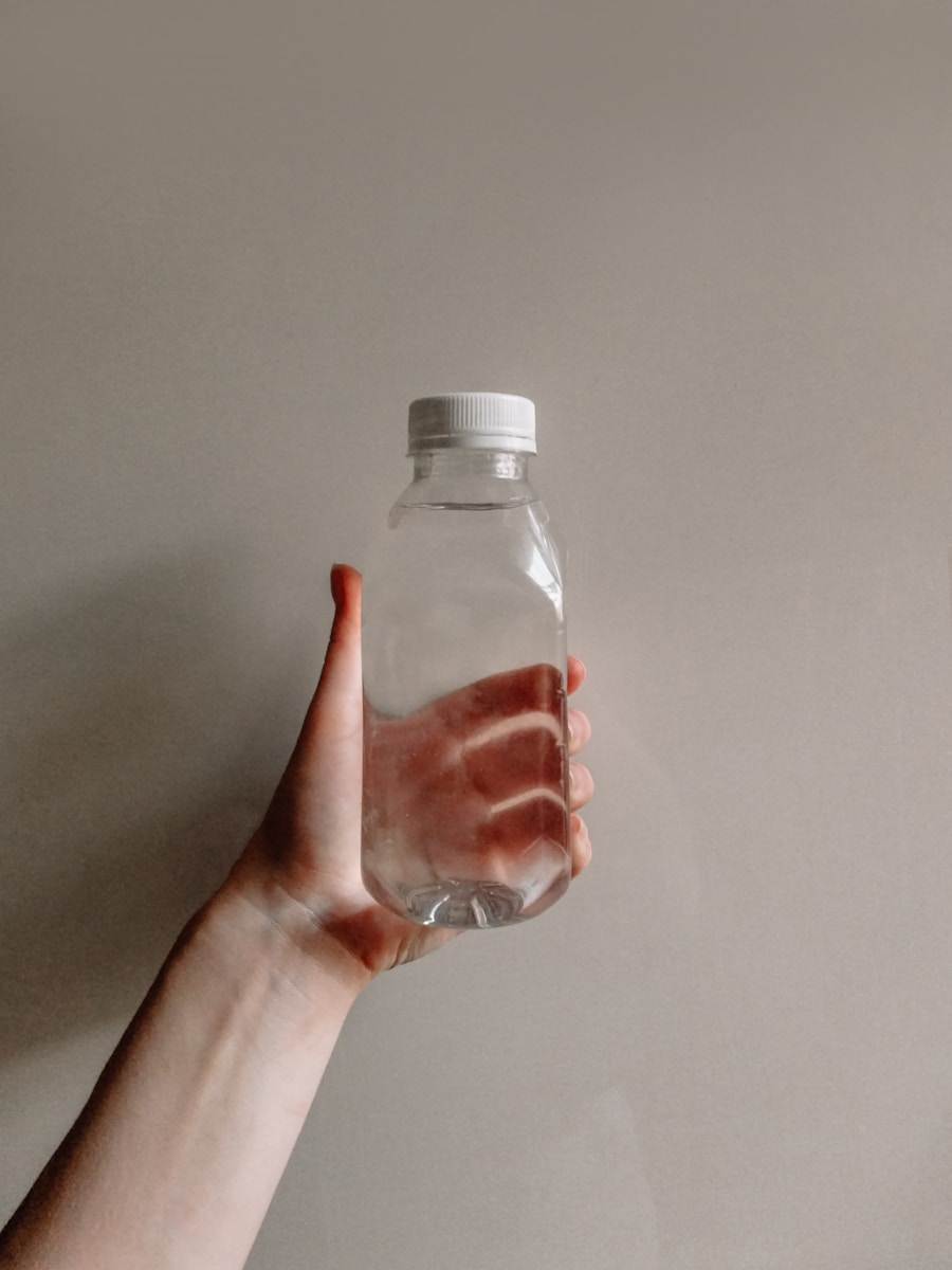 a hand holding a bottle